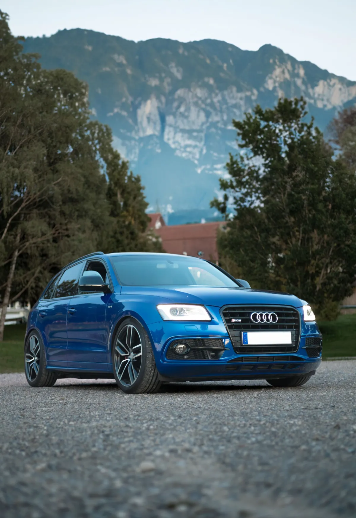 A blue Audi SQ5 photographed from the front three-quarter angle